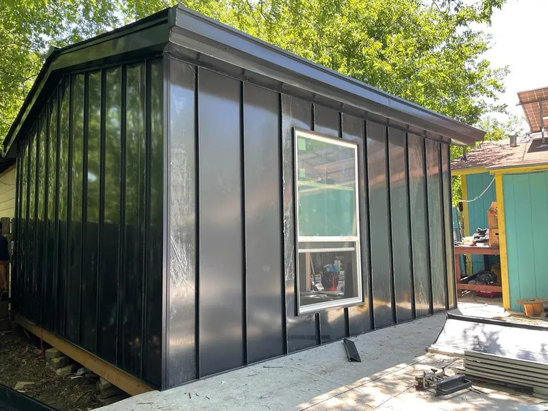 Black standing seam metal wall panels for Roof Inspection in Woodburn