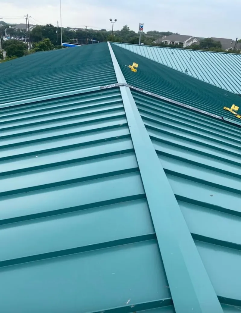 Green commercial metal roof ridge and valley for Metal Roof Repair in Woodburn